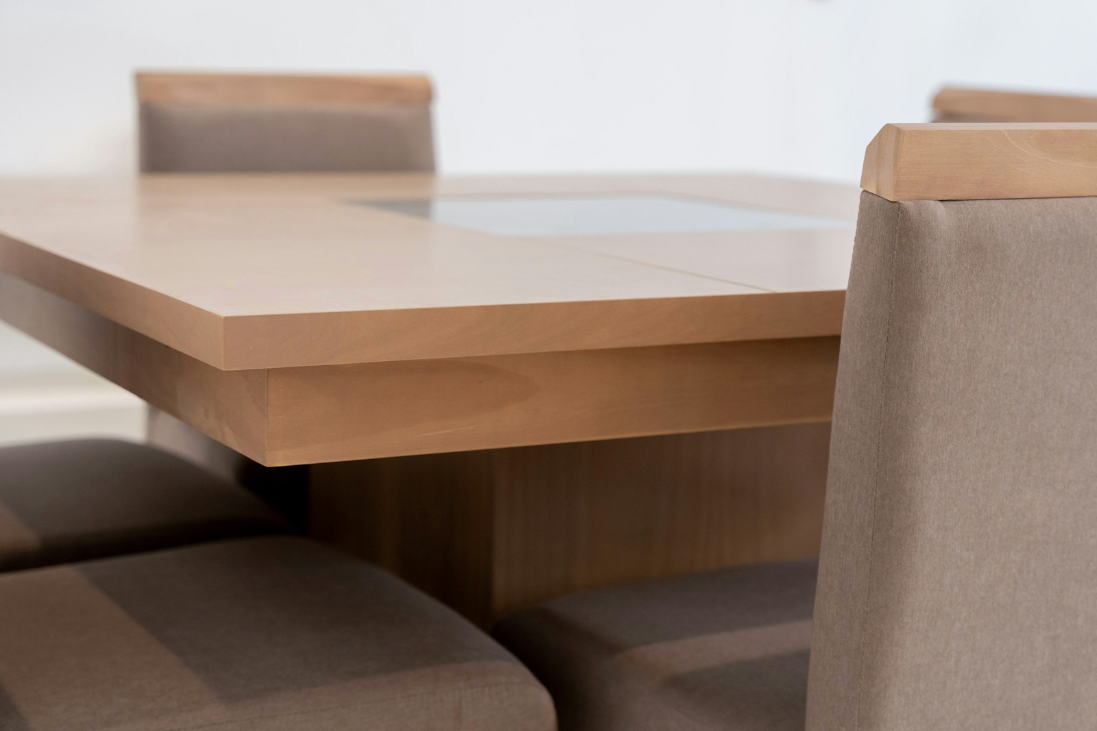 Modern dining table with upholstered chairs